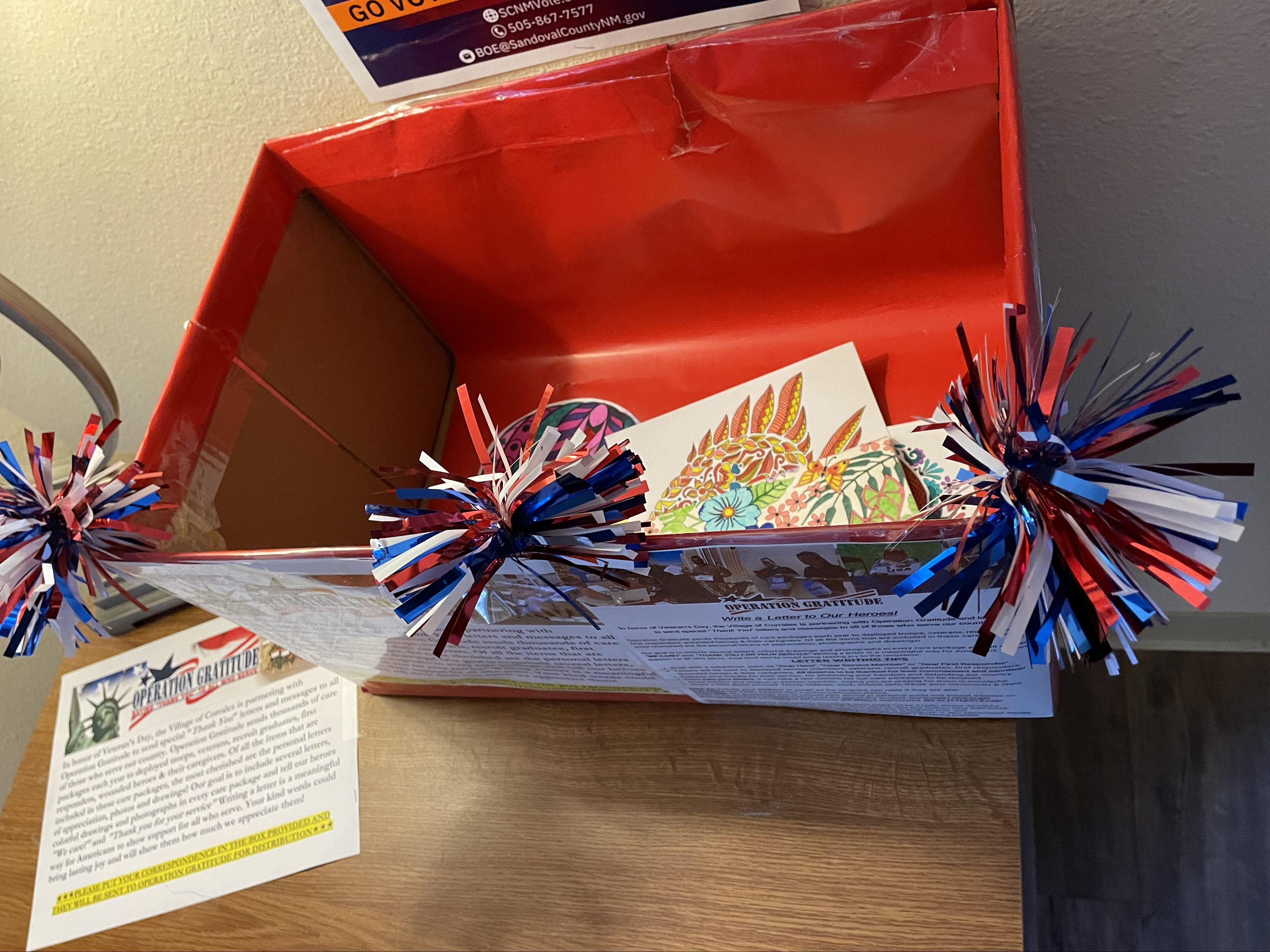 Operation Gratitude drop-off box with letters inside.