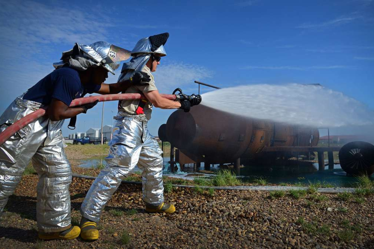 Firefighters with the 27th Special Operations Civil Engineer Squadron test hose water pressure before an exercise Aug. 14, 2015, at Cannon Air Force Base, N.M. (U.S. Air Force photo/Staff Sgt. Alex Mercer)