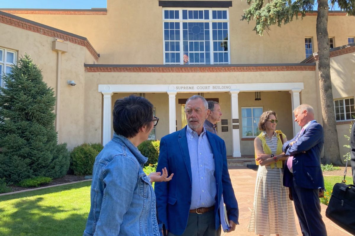 Members of Protect Tesque board members Rusty Day, Clara Dougherty and attorney Tom Hnasko speak with Tesuque Village residents after the New Mexico Supreme Court ruling, which denied the group’s emergency petition in a dispute over a wastewater permit. (Danielle Prokop, Source NM)