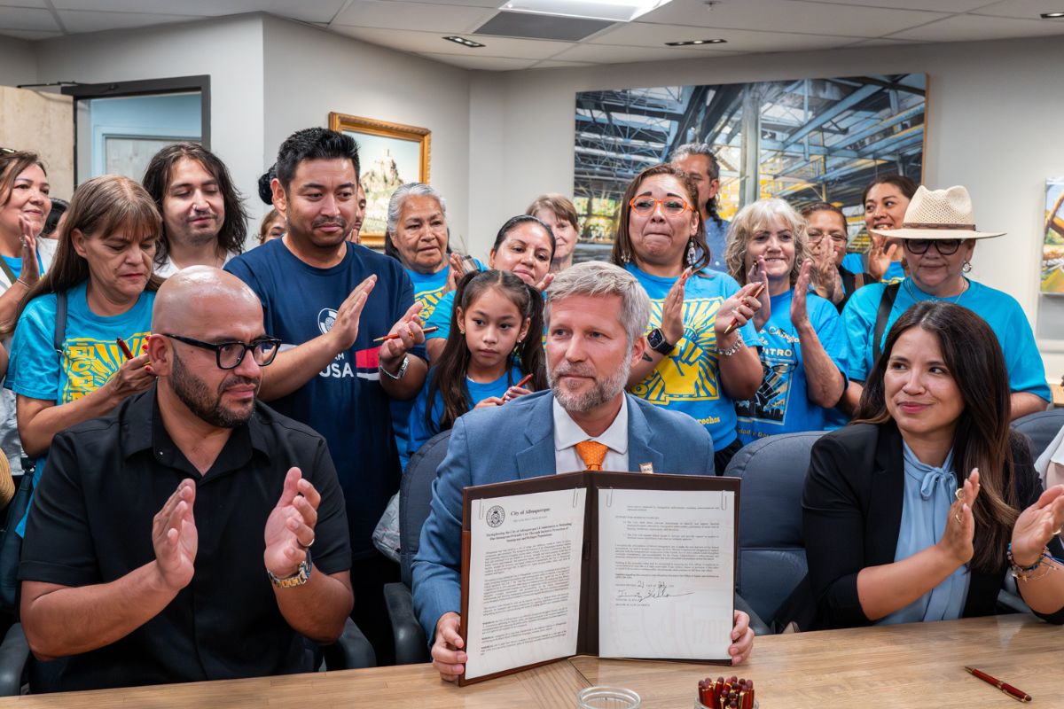 Mayor Tim Keller, joined by members of the Albuquerque City Council, held a press conference to announce a new Executive Order that reaffirms the City’s longstanding commitment to supporting and protecting Albuquerque’s immigrant and refugee communities. Pictured is Mayor Keller flanked by Speaker of The House Javier Martinez,left and State Senator Cindy Nava (D), on the right. Roberto E. Rosales / New Mexico News.