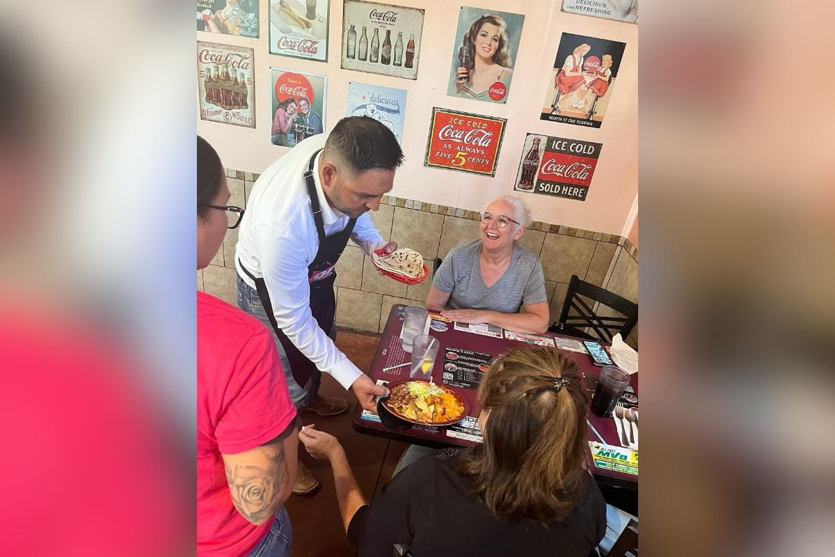 Rep. Gabe Vasquez donned an apron and worked alongside employees at Barelas Coffee House on Aug. 18 while advocating for permanent policy changes to benefit tipped workers. (Courtesy photo)